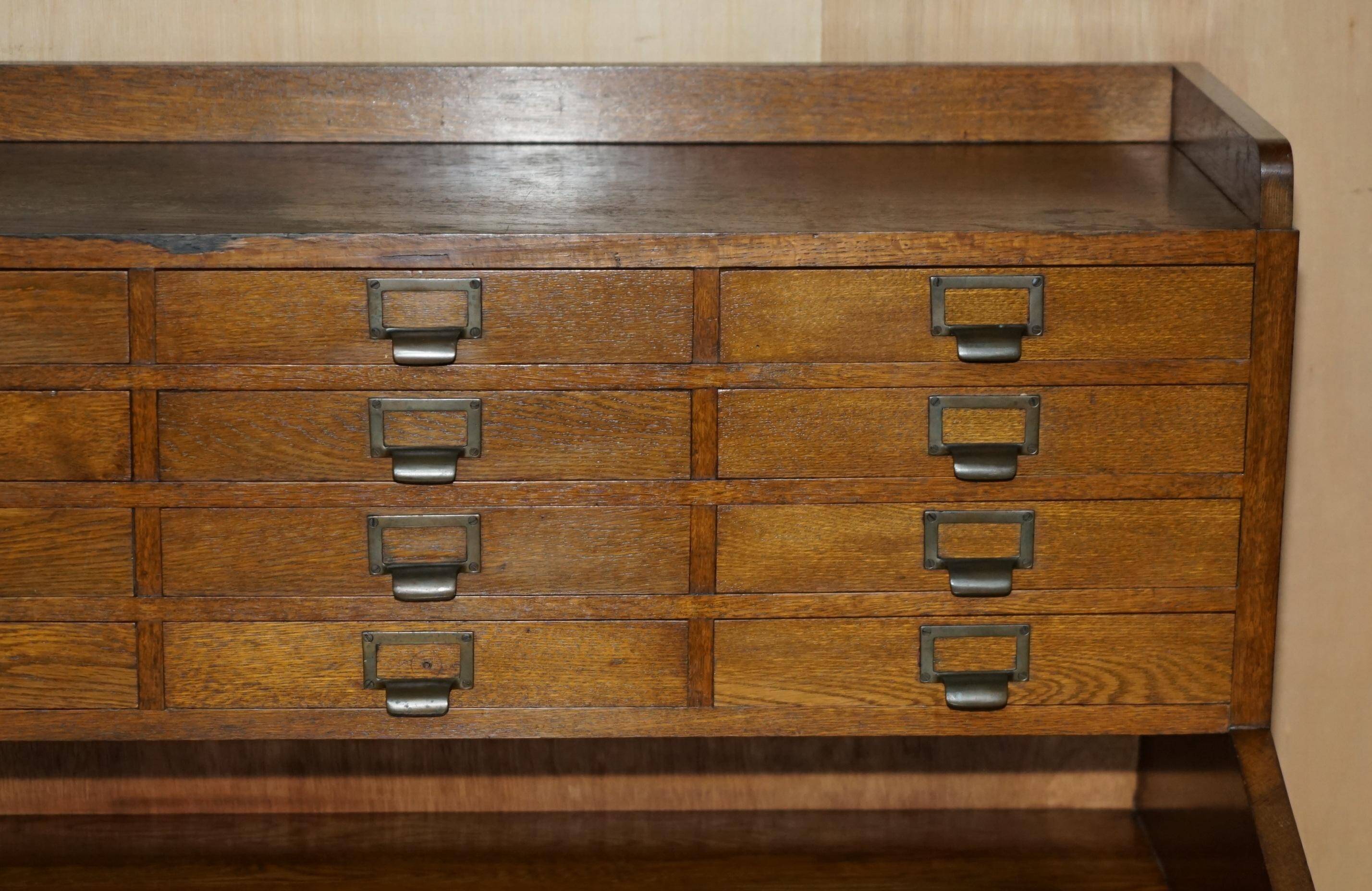 Antique English Art Deco furniture in hand-carved oak, 26 drawers.