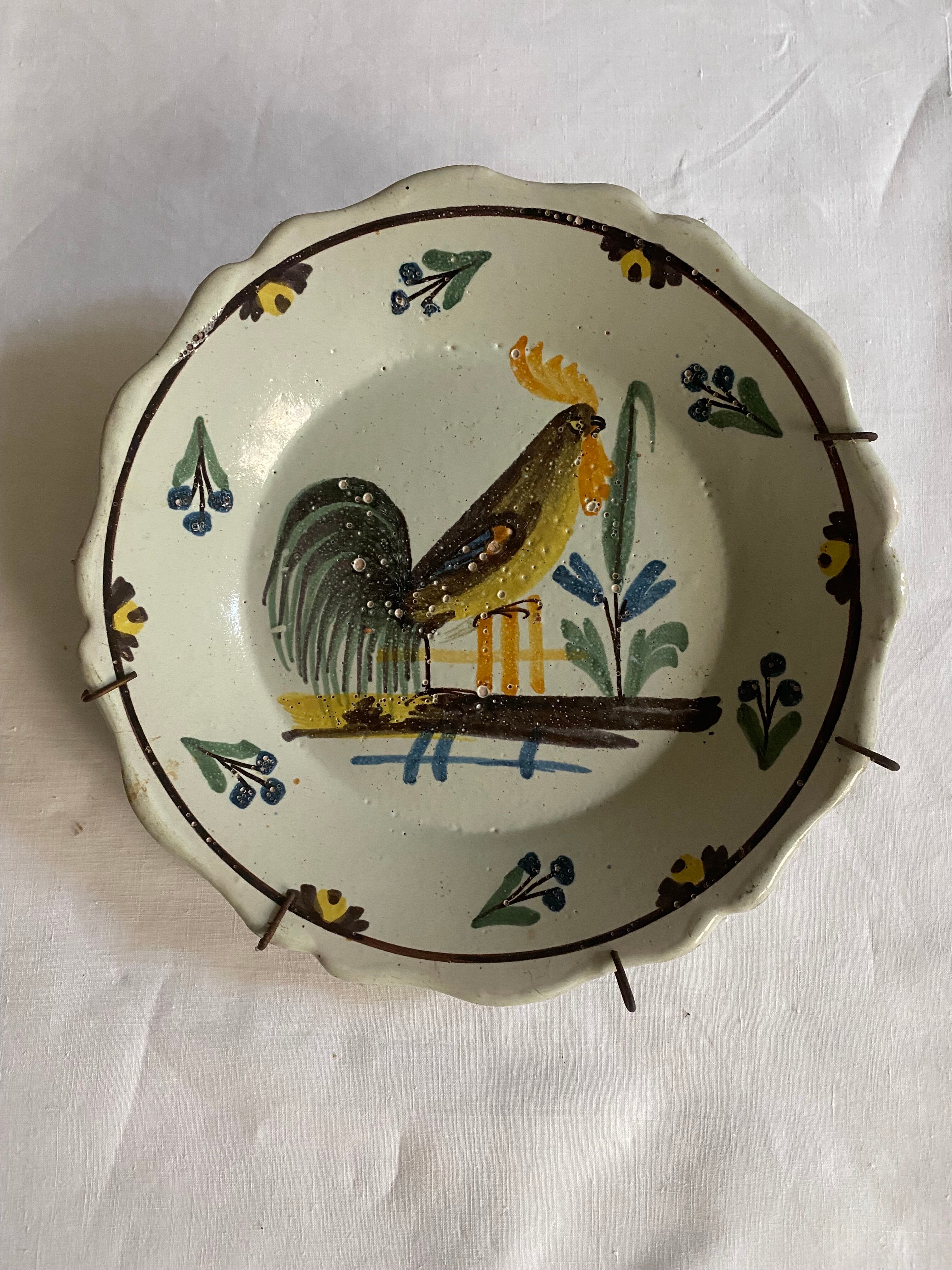Plate of Nevers in earthenware late eighteenth century decoration of rooster on barrier