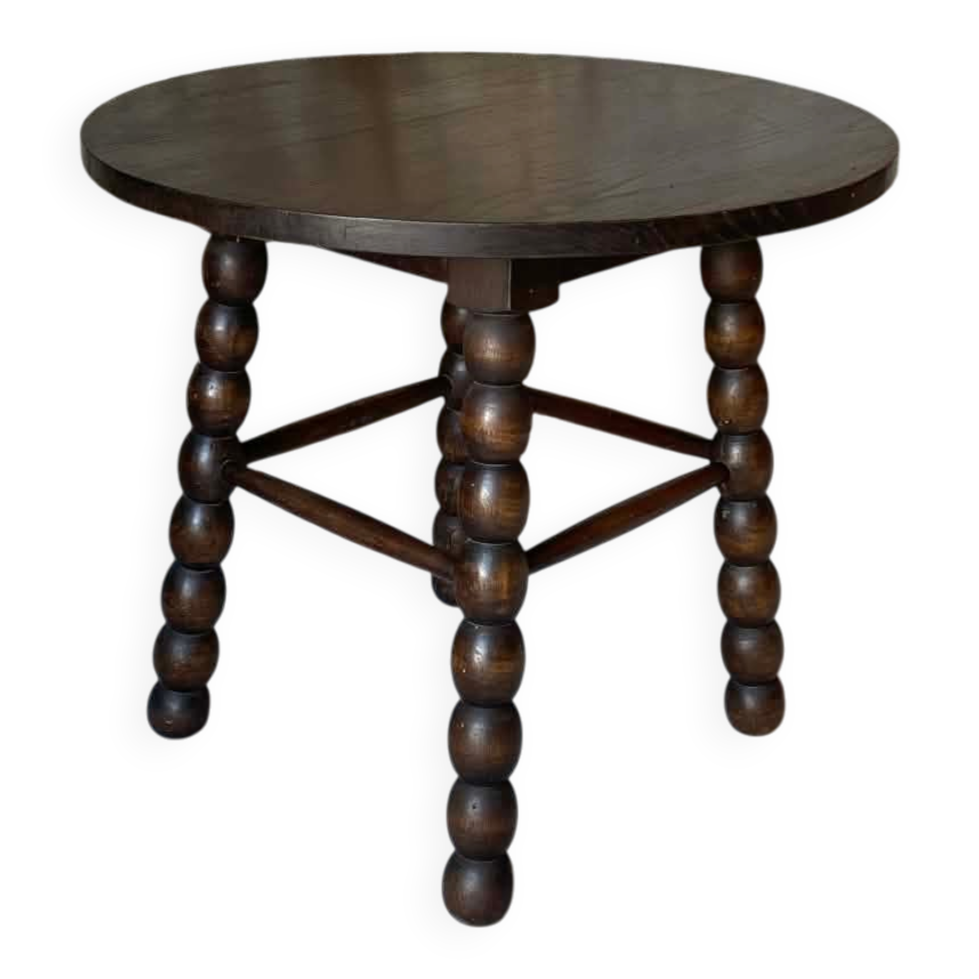 Round wooden coffee table with turned legs.