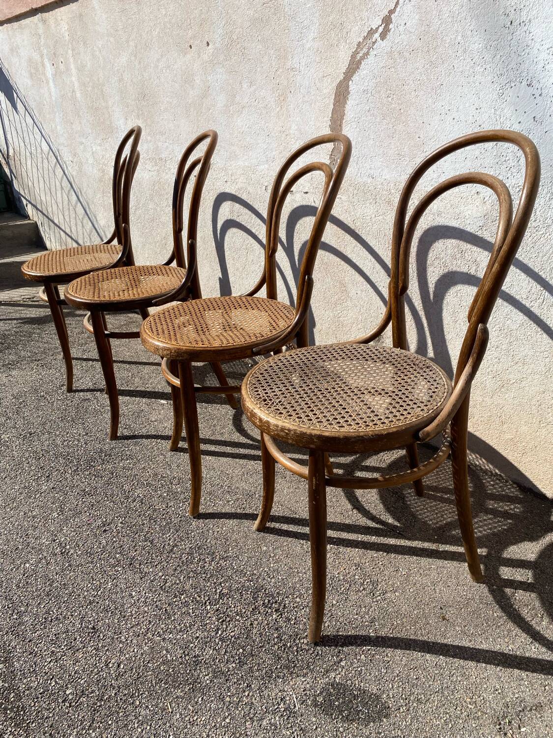 Set of 4 wooden and cane bistro chairs