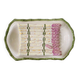 Plate of asparagus with a sauce.