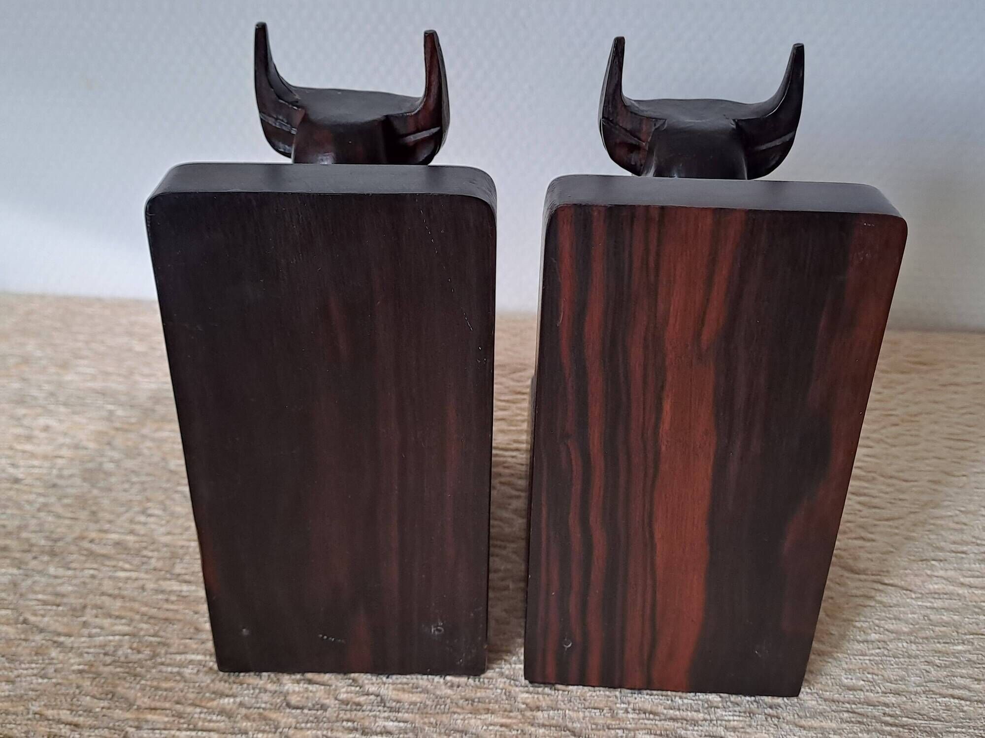 Pair of vintage wooden bookends with stylised horse heads.