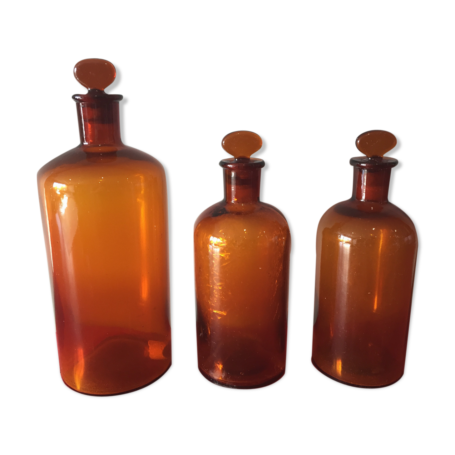 3 old pharmacy vials