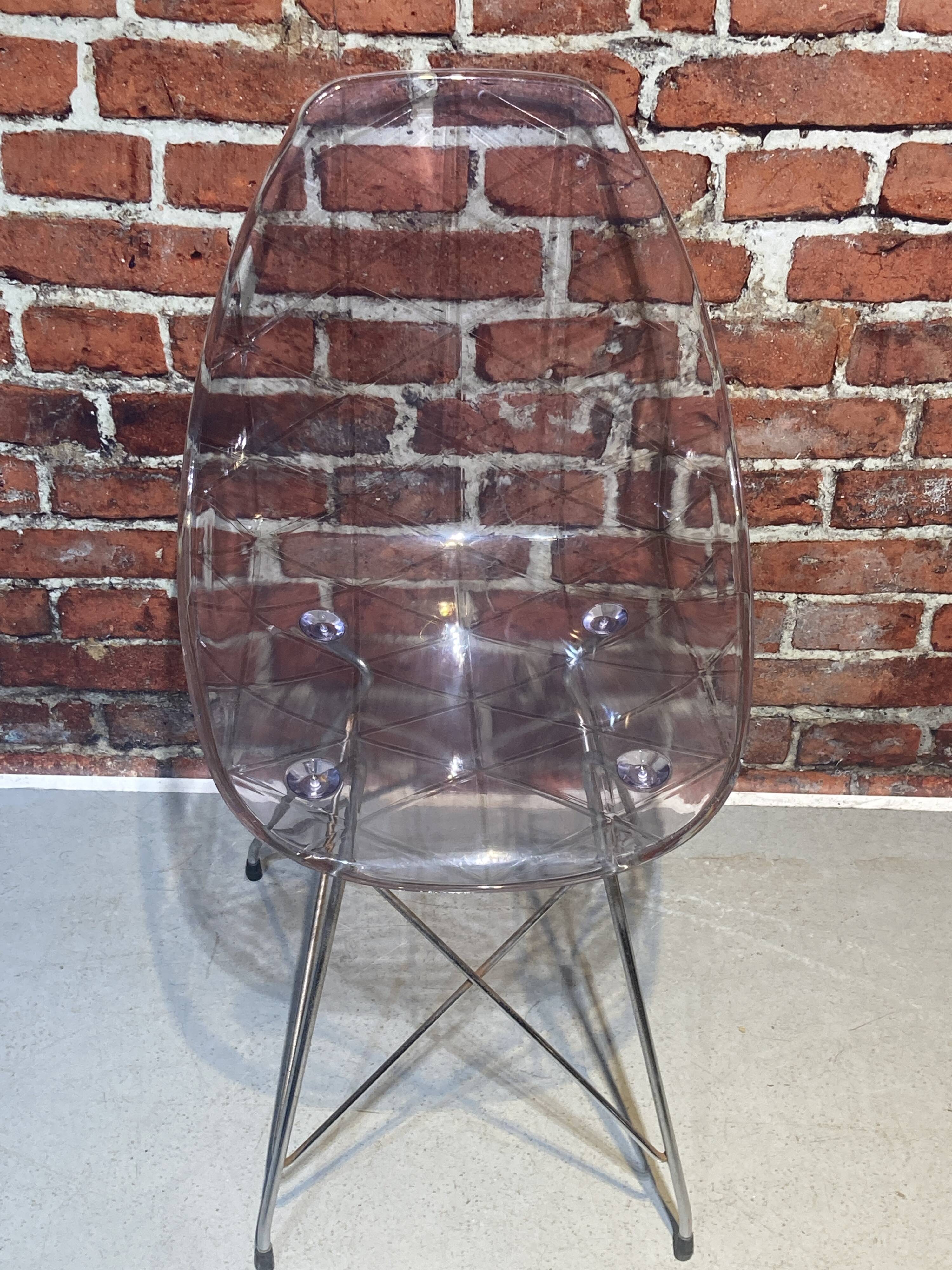 Set of four plexiglass and metal chairs