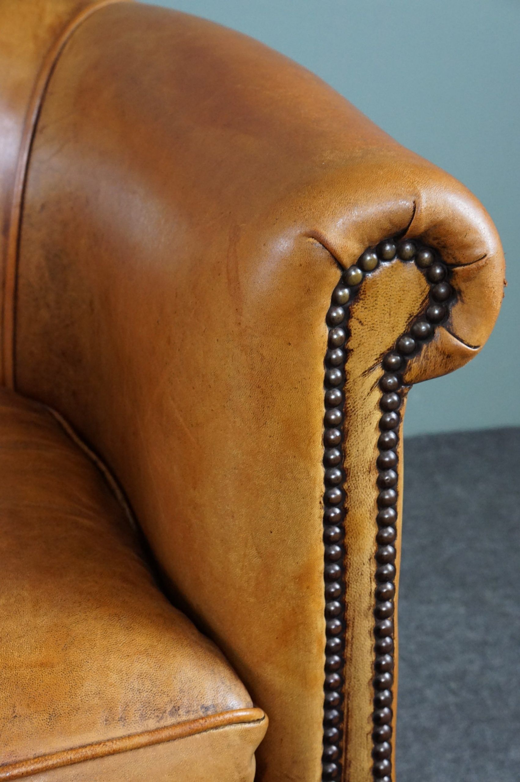 Club armchair in cognac-colored sheepskin