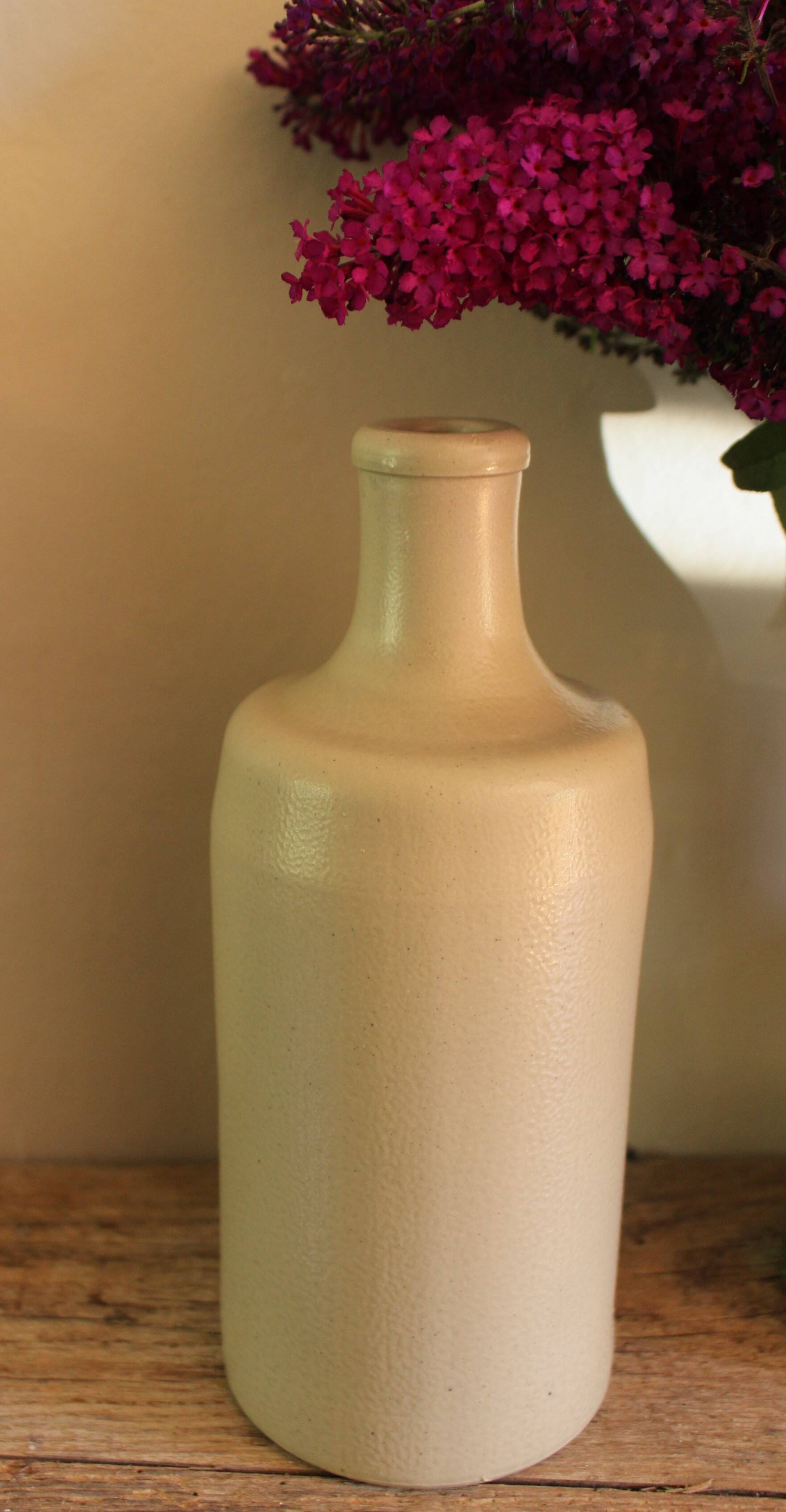 Vintage stoneware liqueur bottle