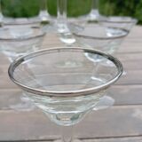 11 bottle-bottom bistro glasses with silver edging, early 20th century