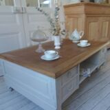 Coffee table on casters, made from an old desk, pearl gray base and belt.