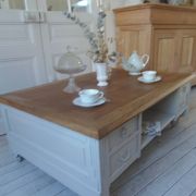 Coffee table on casters, made from an old desk, pearl gray base and belt.
