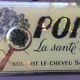 Plaque publicitaire fixé sous verre