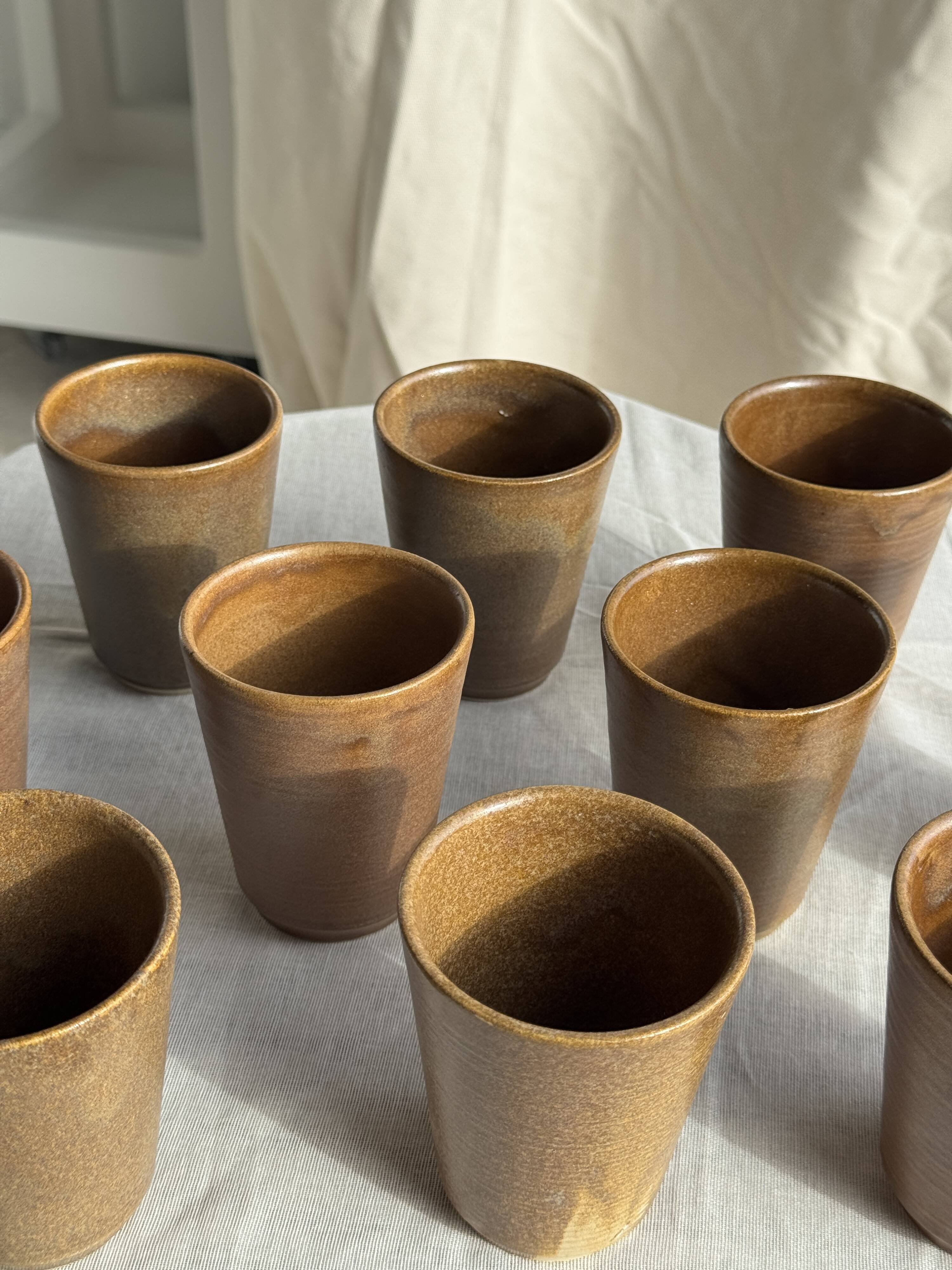 Set of 10 small stoneware mugs from Digoin.