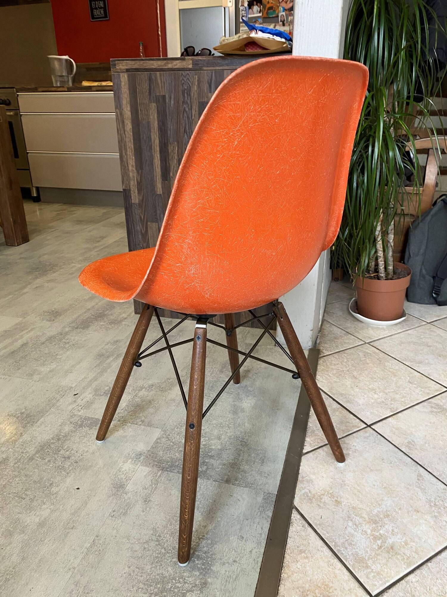 A vintage 70s Eames Herman Miller DSW Fiber Red Orange Dowel Walnut Chair