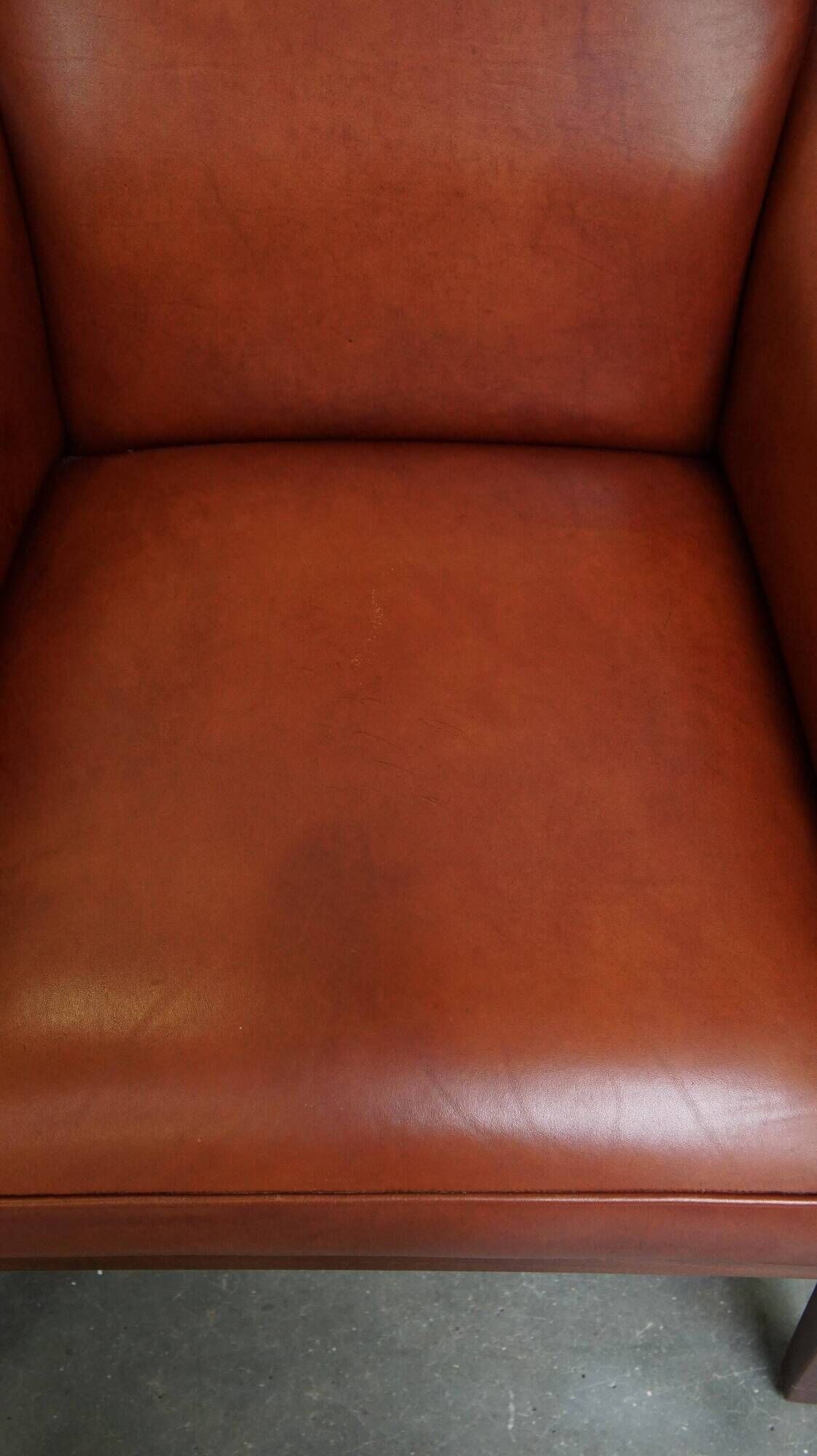 Majestic, luxurious set of 2 cognac-colored cowhide leather Art Deco design armchairs