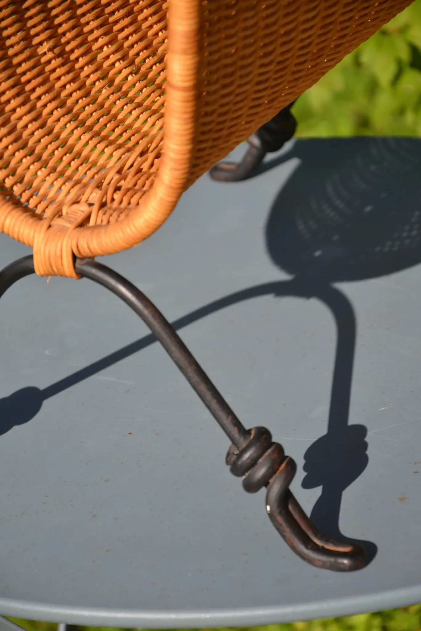 Wrought iron and rattan magazine/newspaper rack