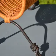 Wrought iron and rattan magazine/newspaper rack