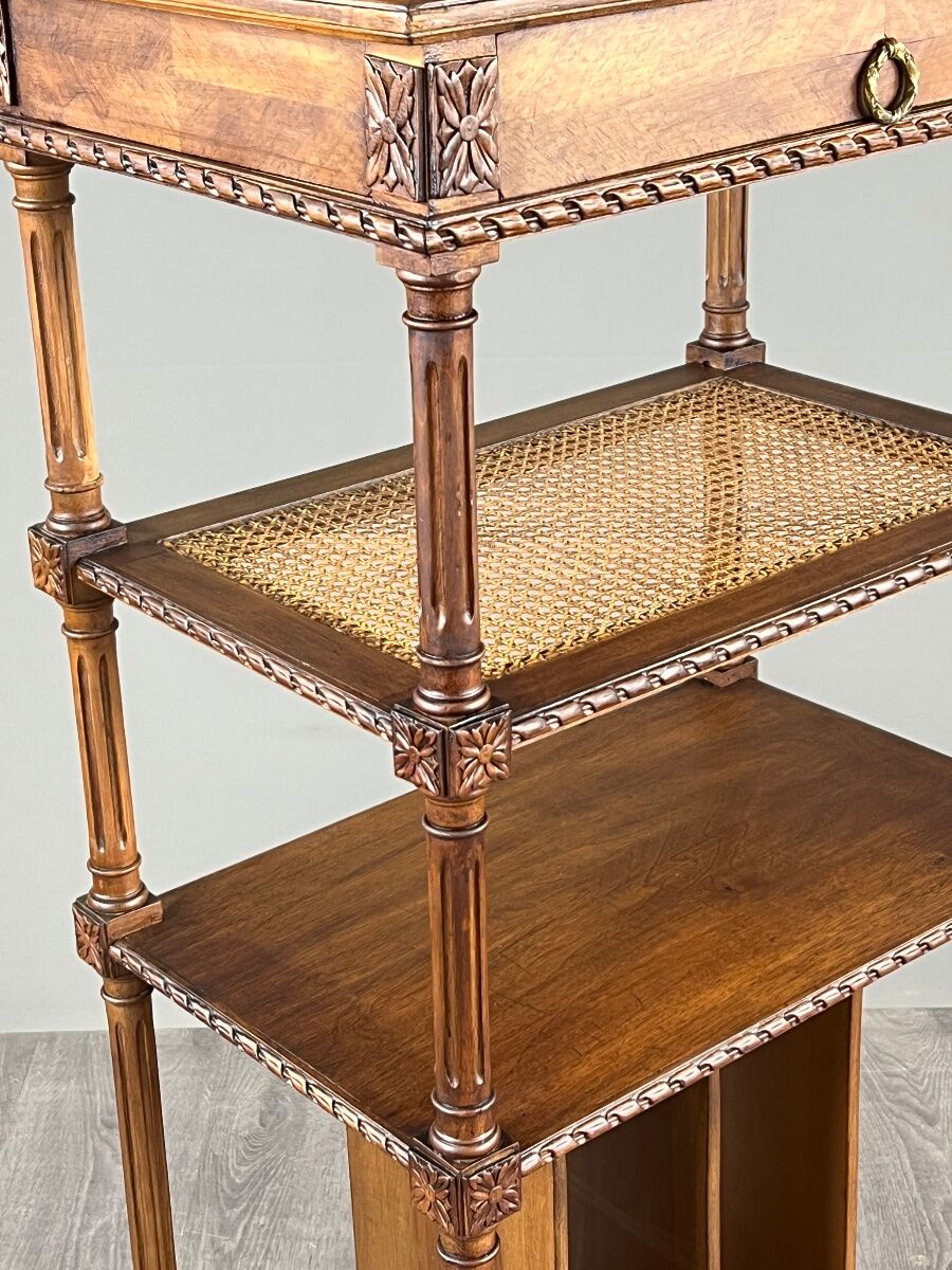 Louis XVI style music cabinet in carved wood with caning, 19th century.