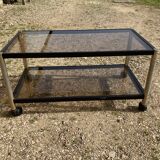 Glass coffee table on wheels