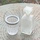 Whiskey carafe and ice bucket in transparent glass and silver-colored metal handle
