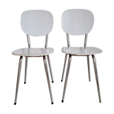Pair of white formica chairs and stripes