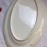 Old ivory-colored, oval-shaped dish with chamfered edge
