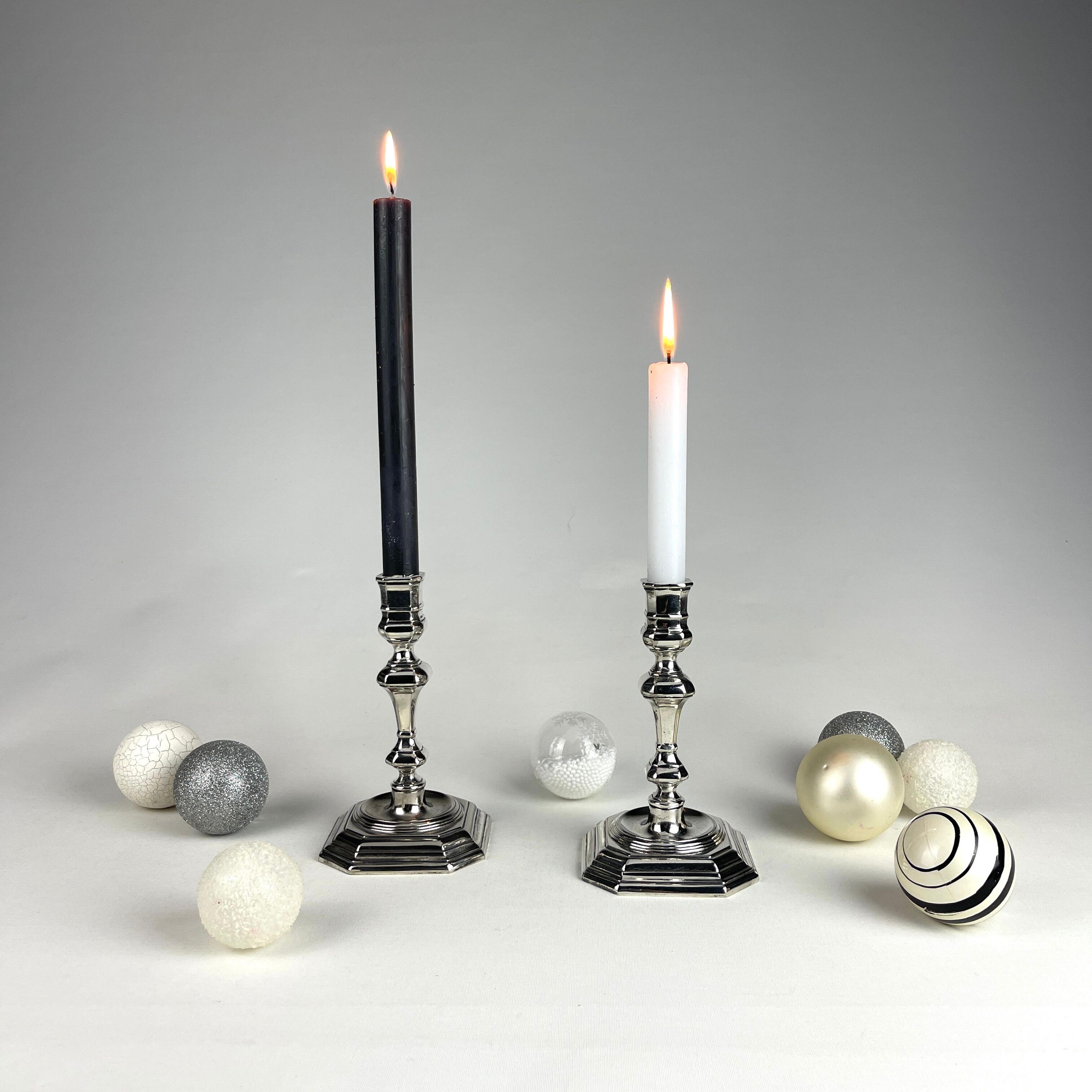 Pair of antique candlesticks in silver metal