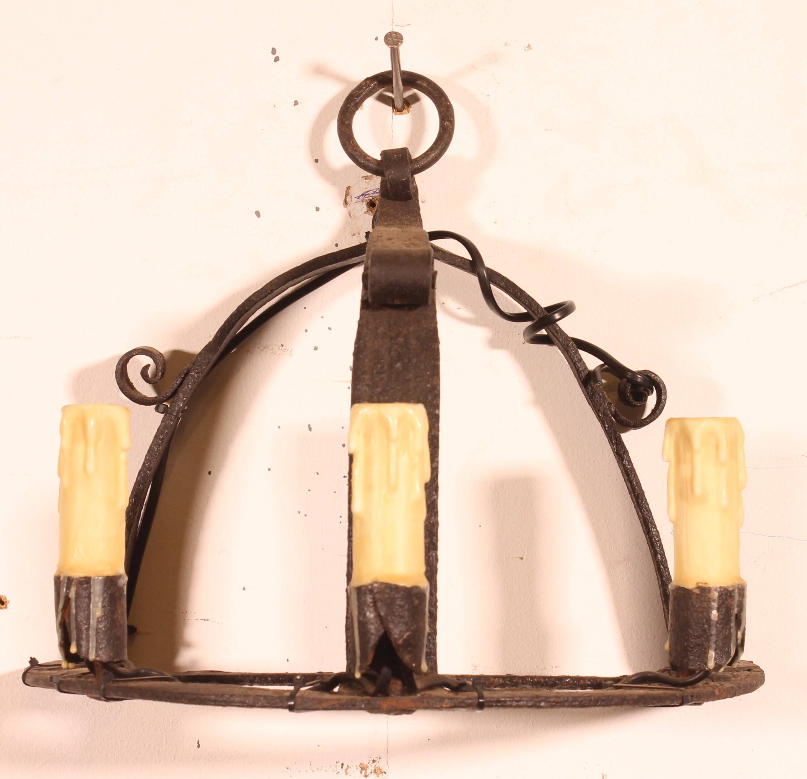 Pair of wrought iron wall sconces in medieval style