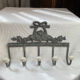 Patinated metal wall bracket and porcelain