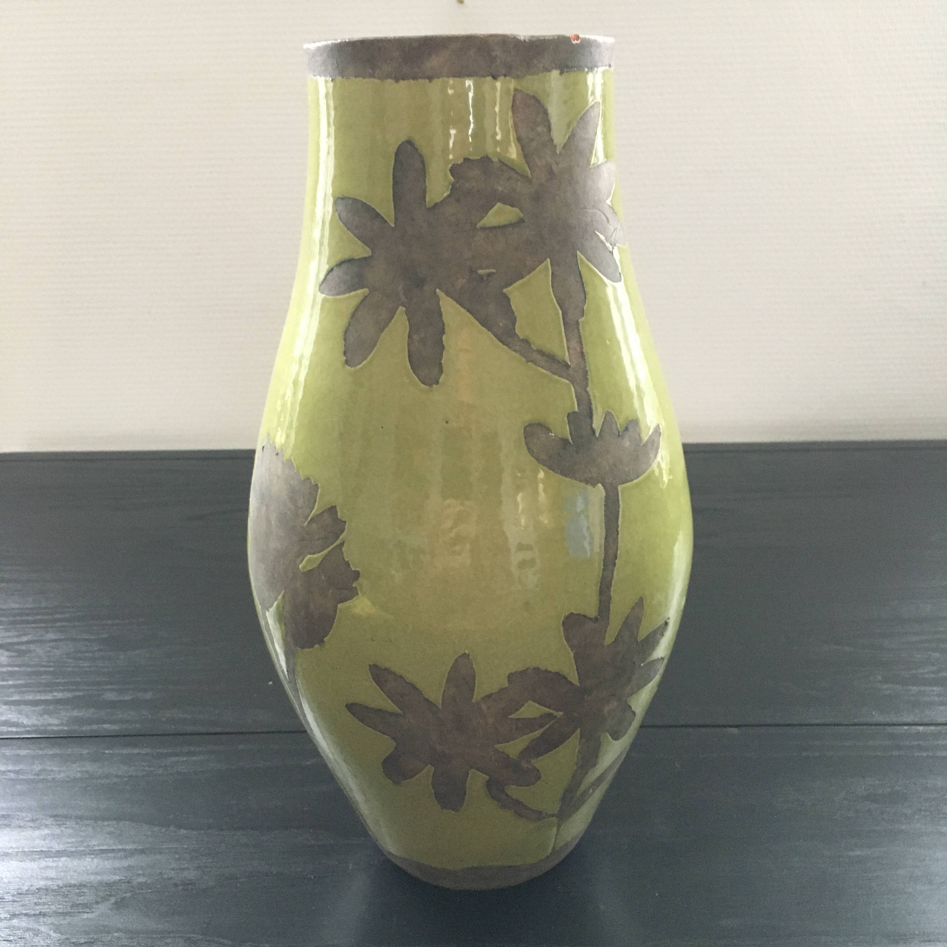 Large green vase with floral decoration