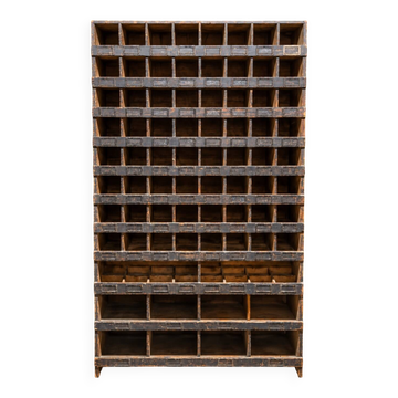 Antique workshop furniture in solid fir with numerous compartments.