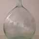 Transparent old demijohn about 8 to 10 L