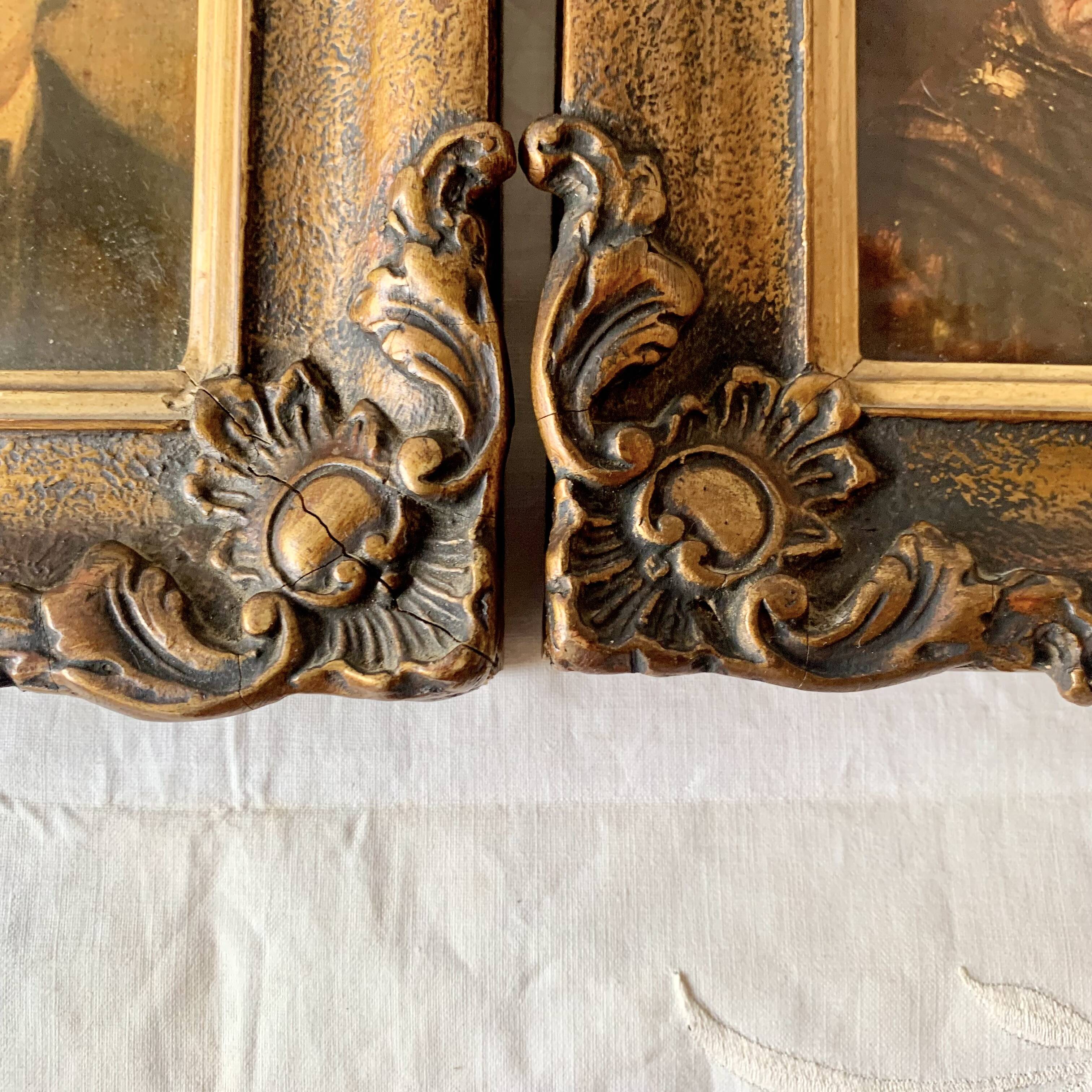 Pair of old carved wooden and plaster frames
