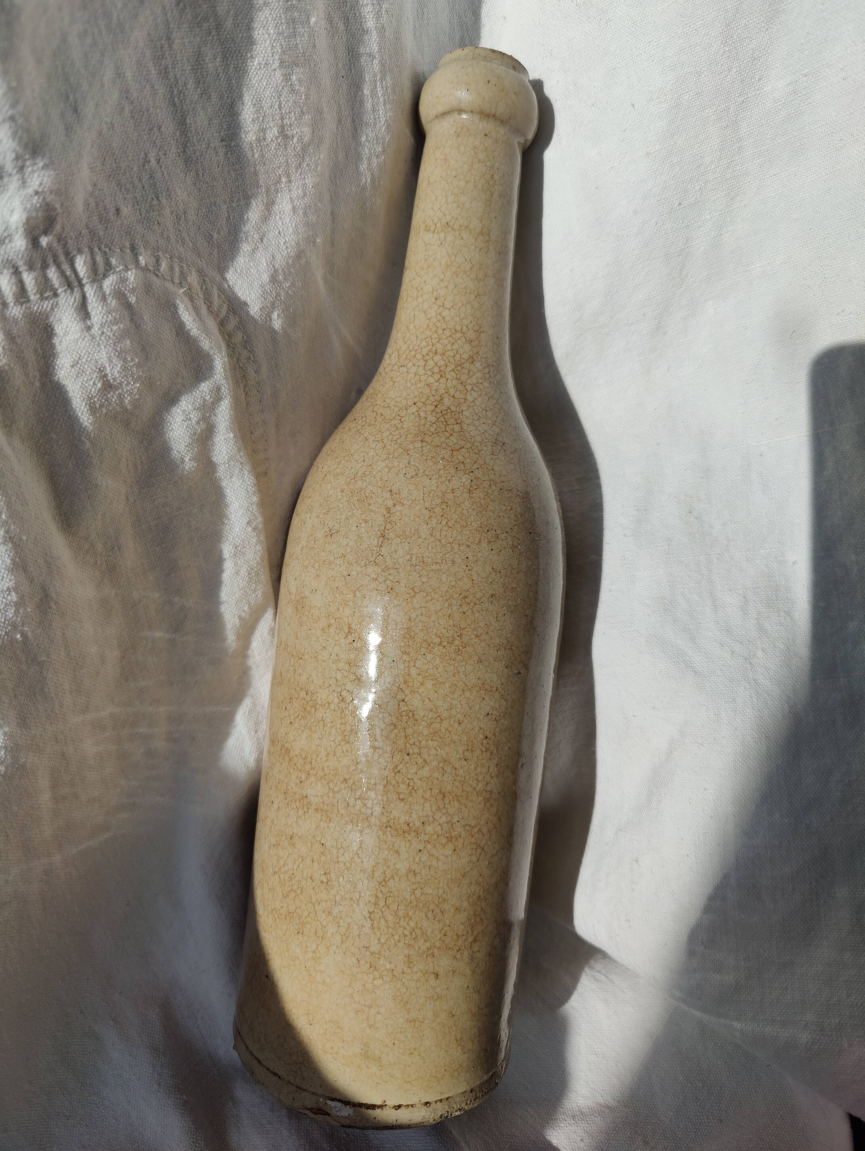 Vintage enamelled stoneware bottle