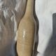 Vintage enamelled stoneware bottle