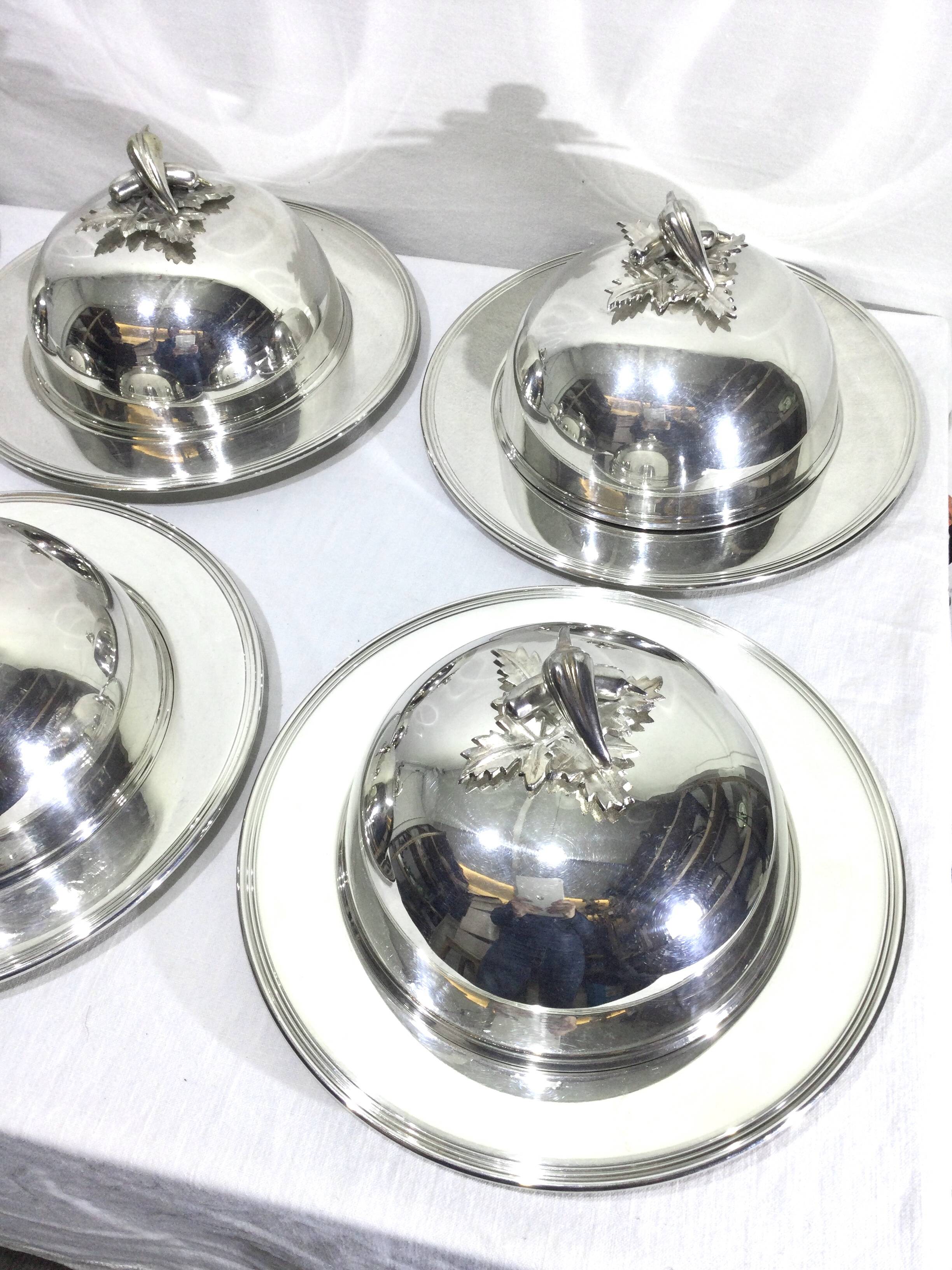 Set of silver-plated serving dishes and bells