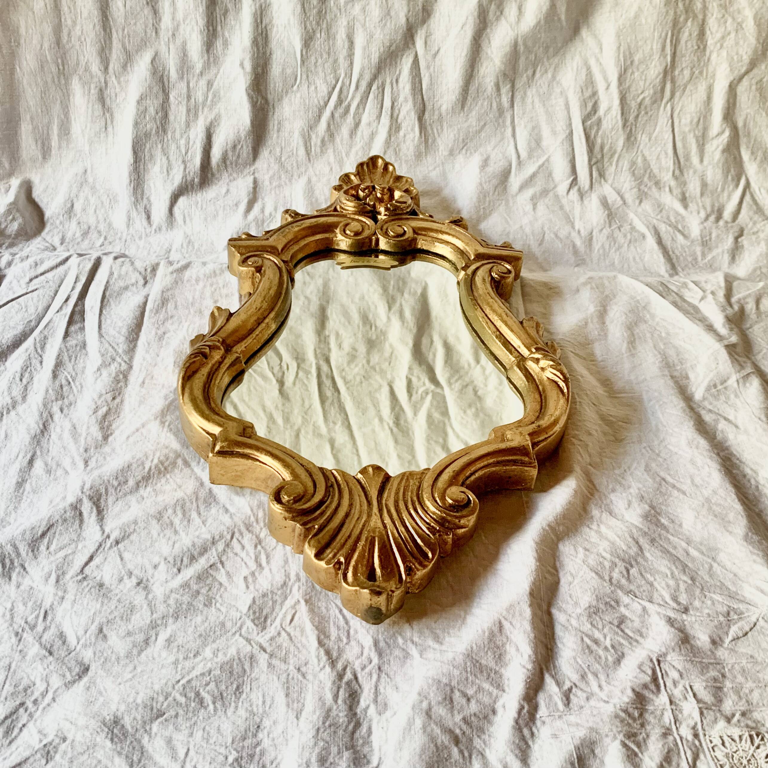 Antique wall mirror in gold leaf resin