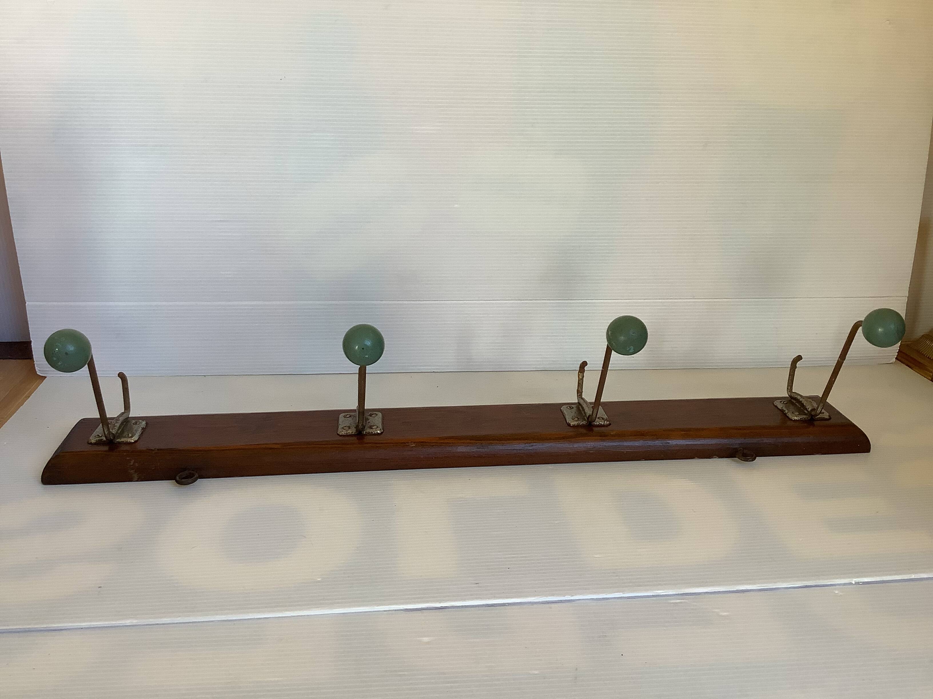 Old coat rack green balls wood metal