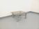 Square Italian vintage Space Age coffee table in smoked glass and metal.