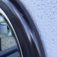 Round vintage mirror in brown resin – 1970s modernist design