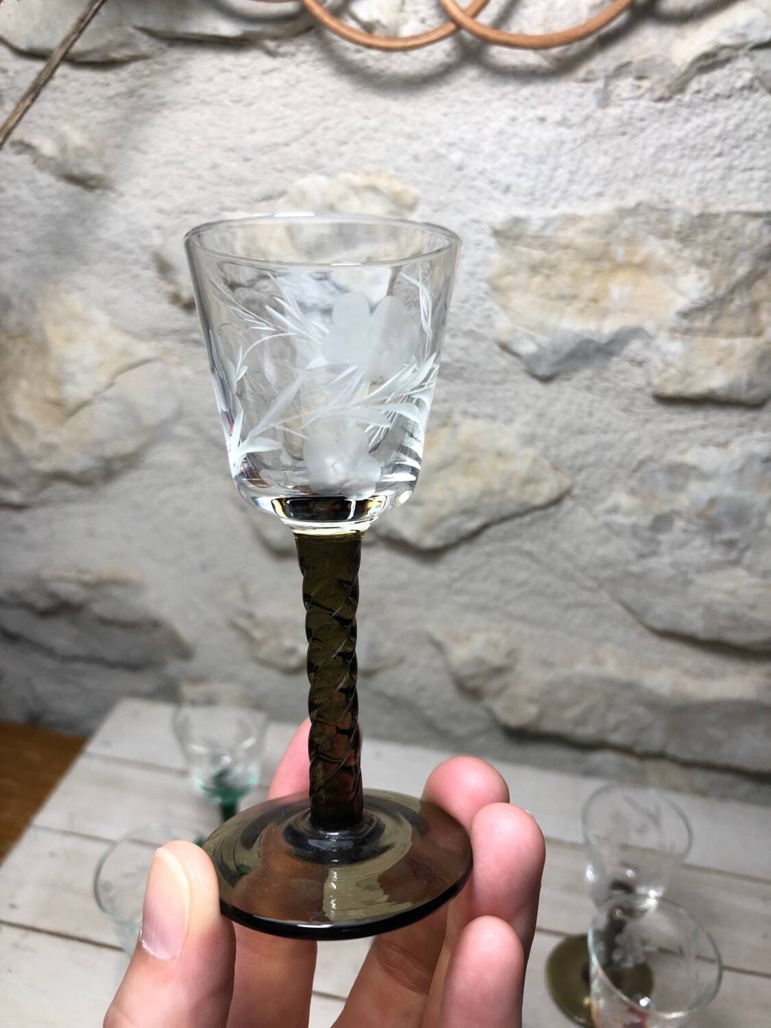 Antique and rare! Sold in a set of 12 colorful twisted stemmed glasses engraved with flowers and leaves