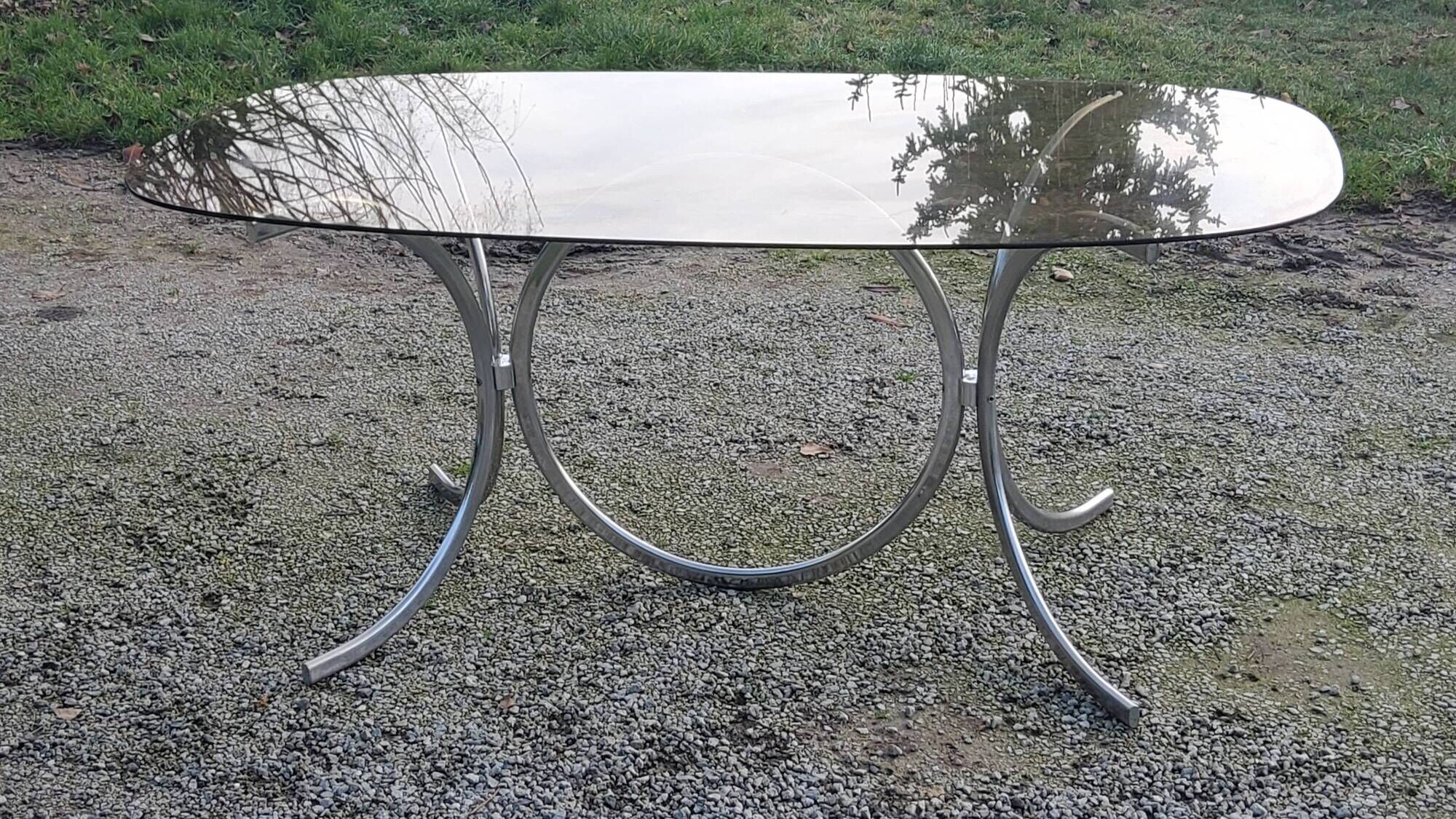 Designer table from the 70s, smoked glass top, chrome base