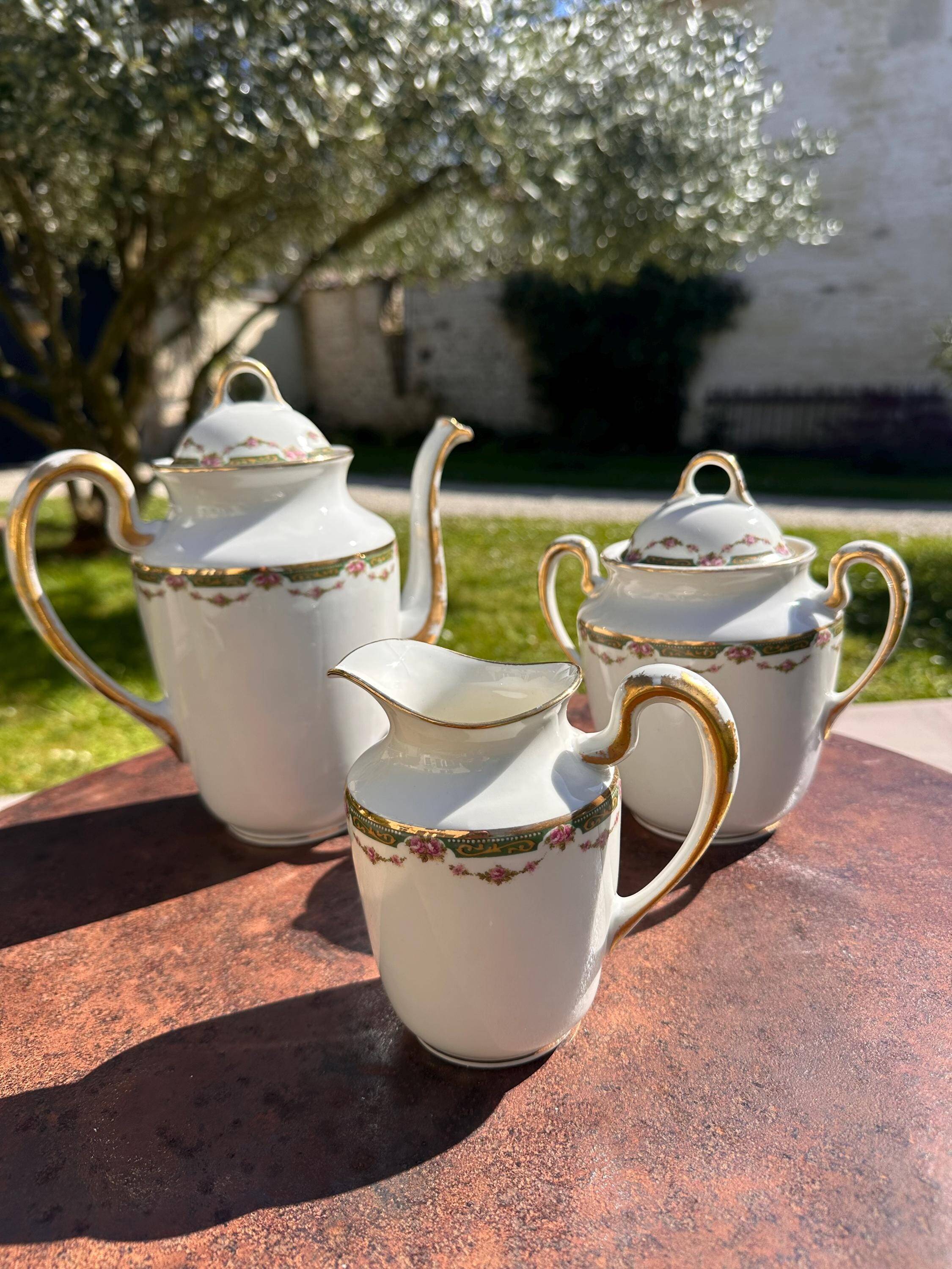 Set of jug, sugar bowl, and milk jug in Limoges porcelain by Paul Past.