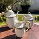 Set of jug, sugar bowl, and milk jug in Limoges porcelain by Paul Past.