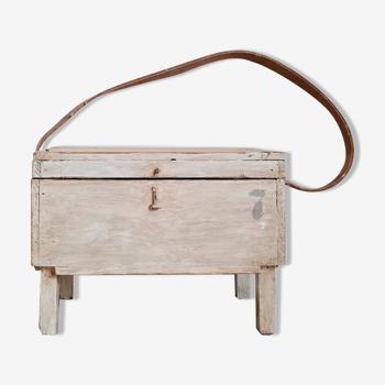 White wooden chest on legs with handle