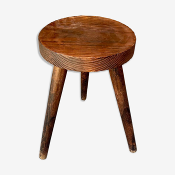 Wooden tripod stool.