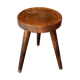 Wooden tripod stool.