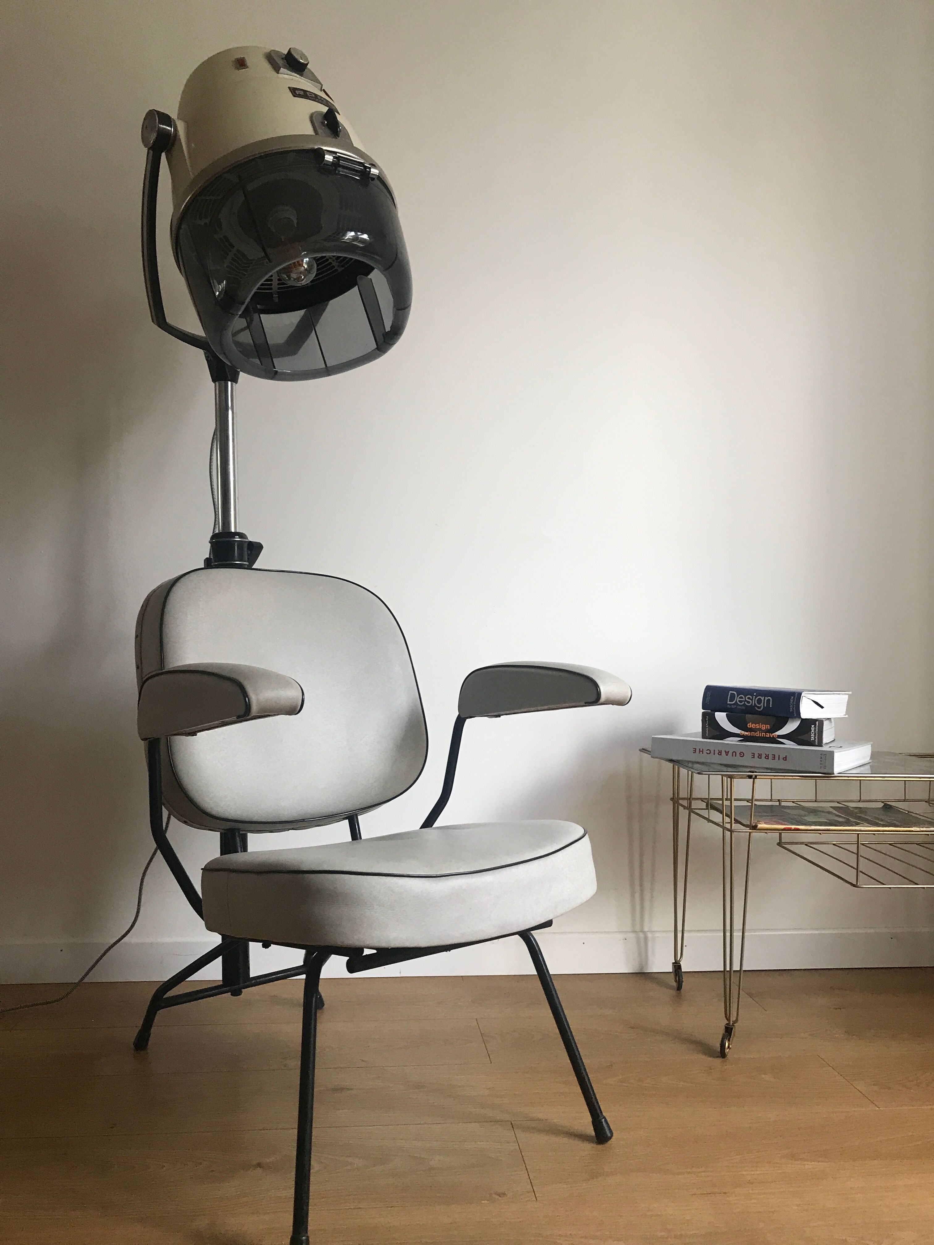Vintage hairdresser's armchair with helmet transformed into a lamp