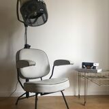 Vintage hairdresser's armchair with helmet transformed into a lamp