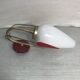 Golden metal wall sconce with red and white opaline reflectors