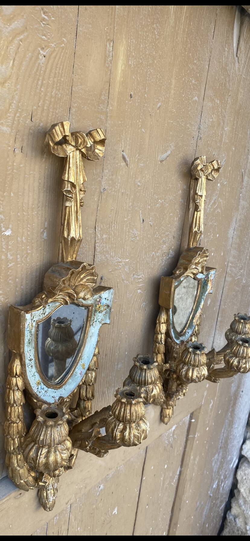 Pair of carved wood sconces
