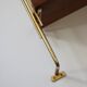 String shelf in teak and gold metal